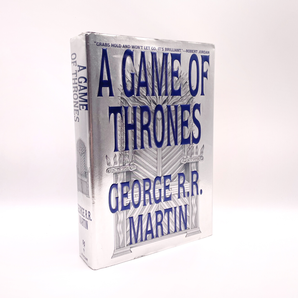 Book titled 'A Game of Thrones' by George R.R. Martin on a white background